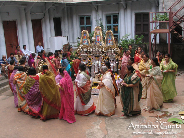 Womanfolk of Darjipara Mitra House performing rituals at their Nilmani Mitra Street premises