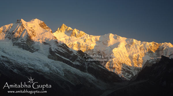 Golden light fading away from Mt. Kangchenjunga and Forked Peak